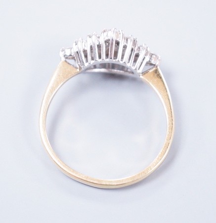 A modern 18ct gold and diamond set marquise shaped cluster ring, size M, gross weight 2.9 grams